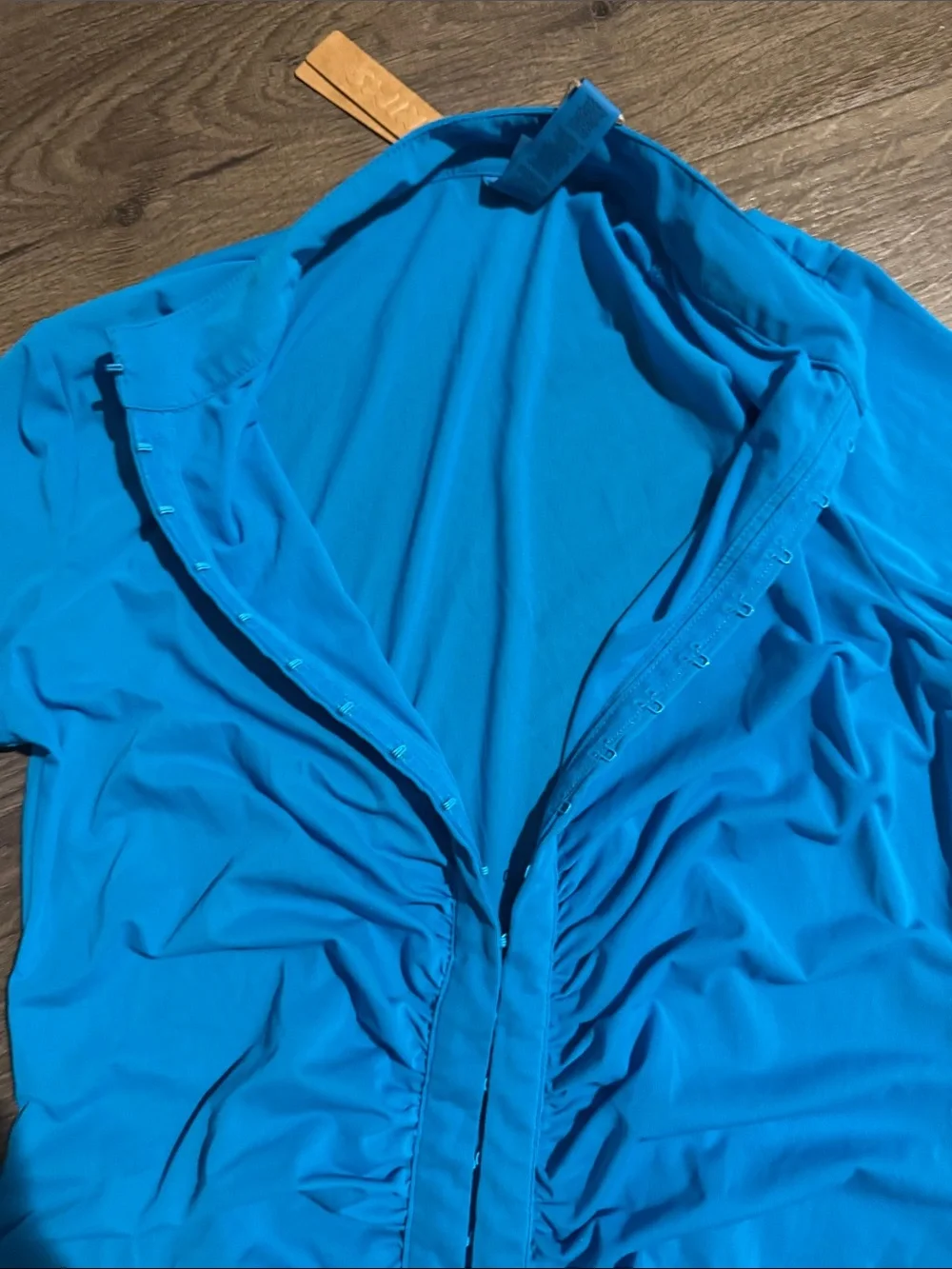 SKIMS Long Sleeve Ruched Front Dress in bright blue. Turquoise